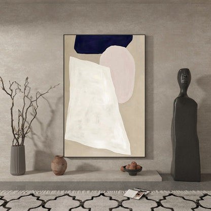 May include: Abstract art print with a white, pink, and blue geometric design on a beige background. The print is framed in black and is hanging on a wall.