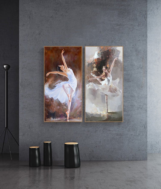 May include: Two framed paintings of ballerinas in white tutus. The ballerina on the left is in mid-air, while the ballerina on the right is standing on one leg. Both paintings have a soft, dreamy feel.