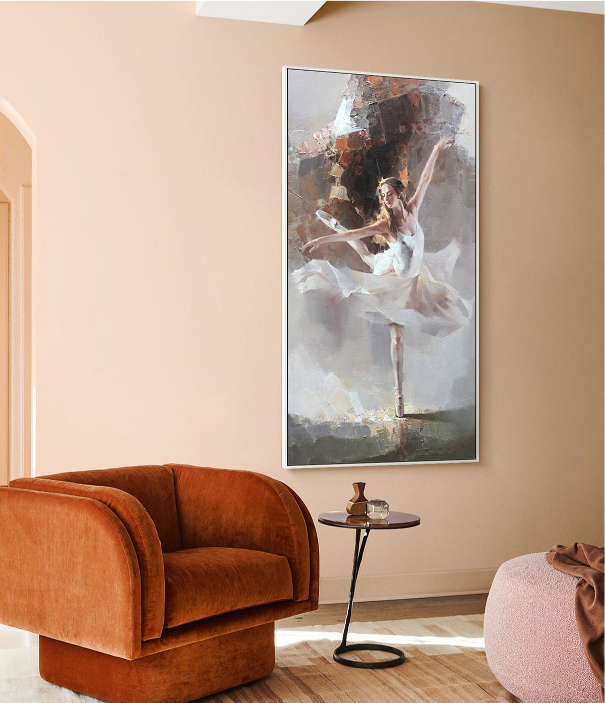 May include: A painting of a ballerina in a white tutu, dancing against a light gray background. The painting is framed in a white frame and is hanging on a light pink wall.