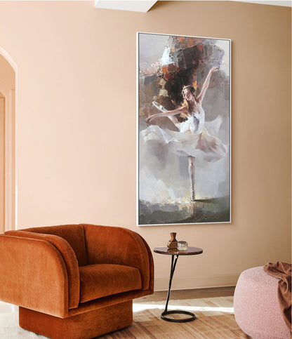 May include: A painting of a ballerina in a white tutu, dancing against a light gray background. The painting is framed in a white frame and is hanging on a light pink wall.