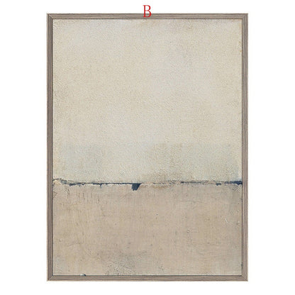 May include: Abstract art print with a beige and gray color scheme. The print features a horizontal line dividing the canvas into two sections. The top section is a lighter beige, while the bottom section is a darker gray. The print is framed in a light wood frame.