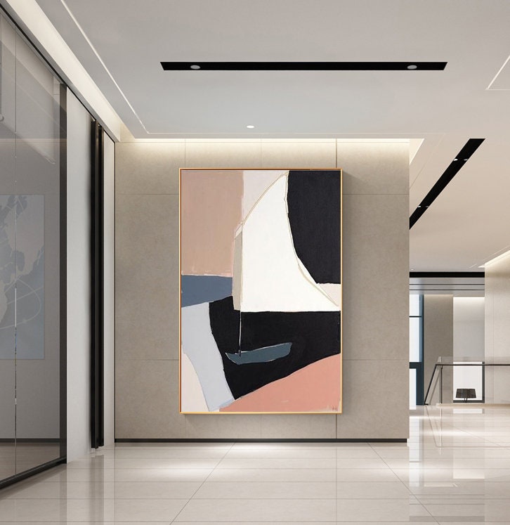 May include: Abstract art print featuring geometric shapes in shades of pink, white, black, and blue. The print depicts a stylized sailboat with a white sail.