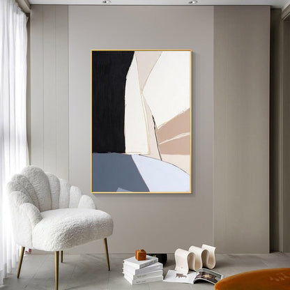 May include: Abstract art print with a gold frame. The print features geometric shapes in shades of black, white, brown, and blue.
