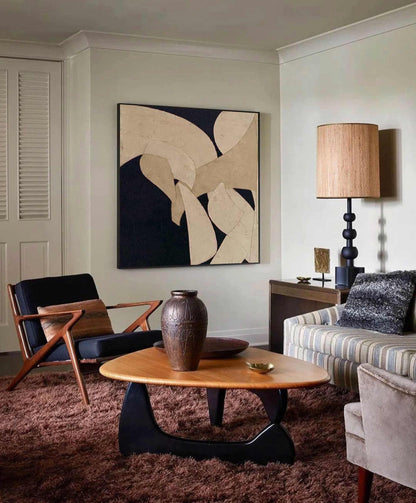 May include: A mid-century modern living room with a brown shag rug, a wooden coffee table, and a black armchair. A large abstract painting hangs on the wall. A tall lamp with a woven shade and a decorative vase are also present.