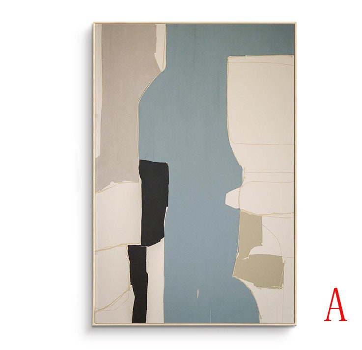 May include: Abstract art print with geometric shapes in shades of beige, black, white, and blue. The print is framed in a light wood frame.
