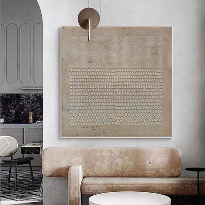 May include: A square wall art piece featuring a beige textured background with a top section of vertical lines and a bottom section of repeating oval shapes. The artwork is framed in a thin white border and displays a neutral color palette.