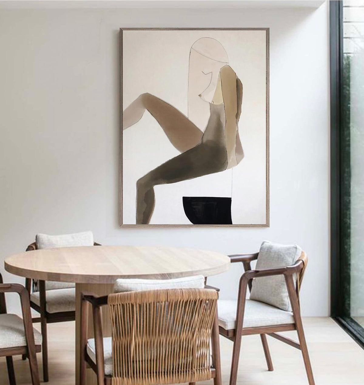 May include: Abstract painting of a person sitting on a stool, with a brown and black color scheme. The painting is framed and hanging on a white wall.