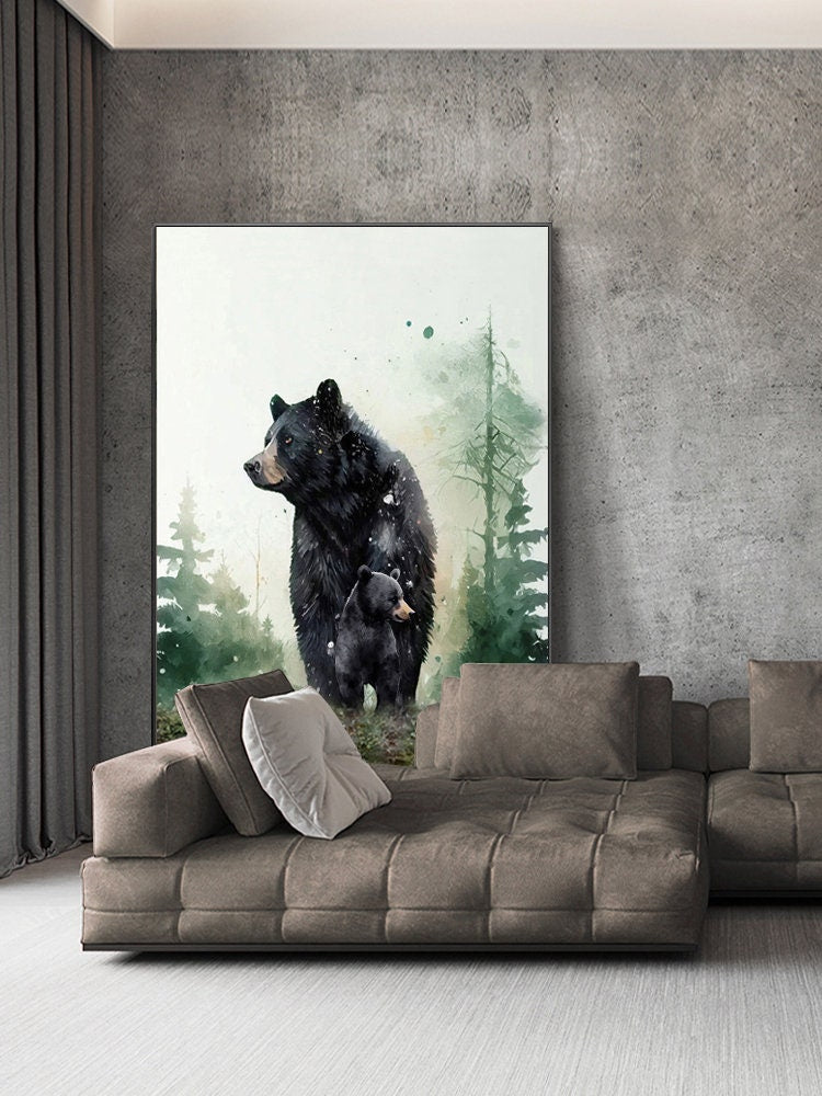 May include: A watercolor painting of a black bear and a cub standing in a forest. The painting is framed and hanging on a wall above a brown couch.