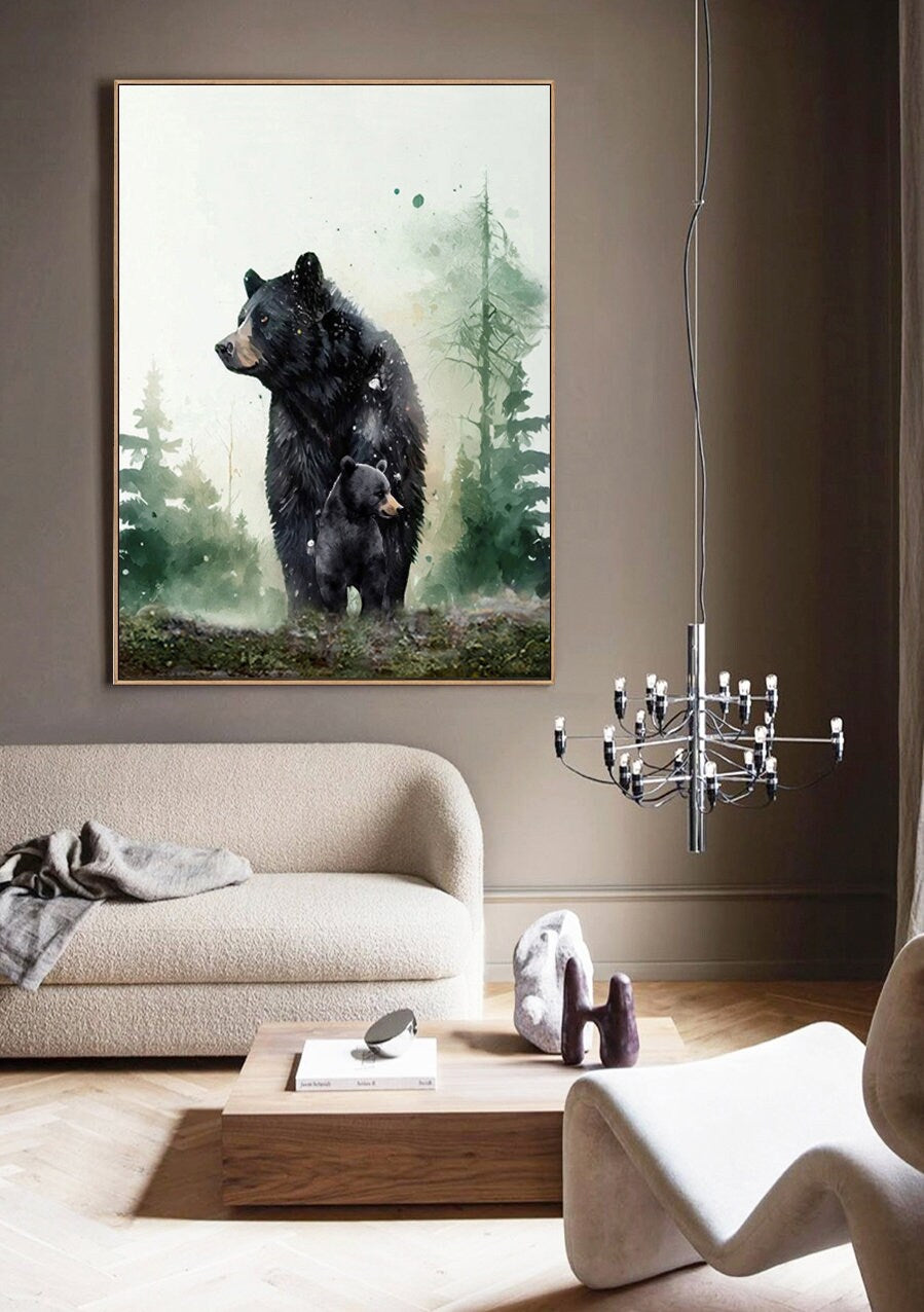 May include: A watercolor painting of a black bear and her cub standing in a forest. The painting has a soft, dreamy feel, with a light green and white background.