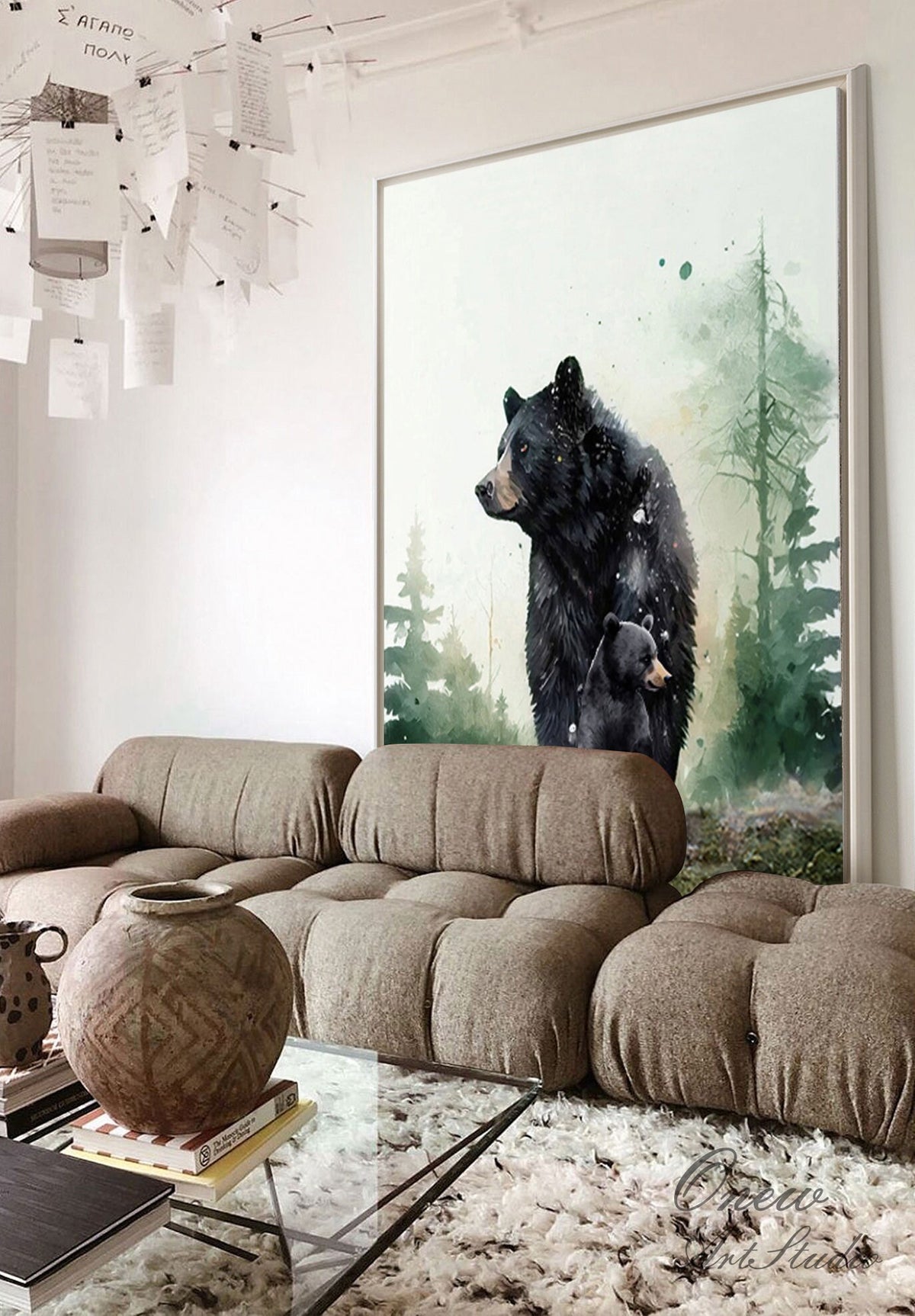 May include: Watercolor painting of a black bear and her cub standing in a forest. The painting has a green and white background with a watercolor effect.
