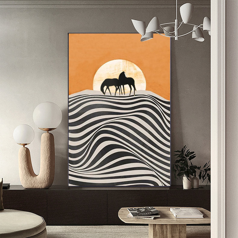May include: Abstract art print featuring two black silhouettes of horses standing on a hill with a large orange sun behind them. The hill is made up of black and white stripes that create a wavy pattern.