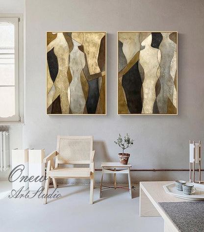 May include: Two abstract paintings with a gold frame. The paintings feature a geometric design of brown, black, and white figures.