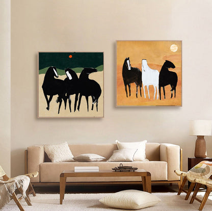 May include: Two abstract paintings of horses. The first painting features three black horses on a green background with a red circle in the sky. The second painting features three horses, one white and two black, on a yellow background.