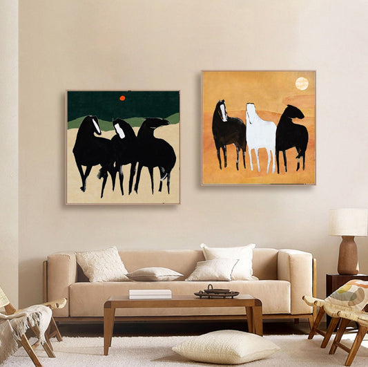 May include: Two abstract paintings of horses. The first painting features three black horses on a green background with a red circle in the sky. The second painting features three horses, one white and two black, on a yellow background.