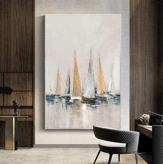 May include: Abstract painting of sailboats on a light blue and white background with gold accents. The sailboats are in a row and the water is calm. The painting is framed in a white frame.