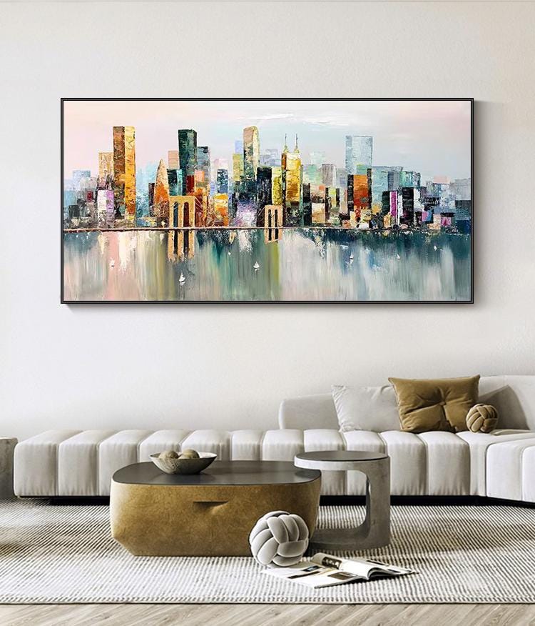 May include: A colorful abstract painting of a cityscape with a reflection of the buildings in the water below. The painting is done in a modern style with bold colors and brushstrokes.