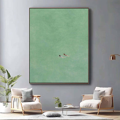 May include: A minimalist painting of two figures swimming in a turquoise sea. The painting has a soft, muted color palette and a simple composition.