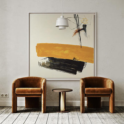 May include: Two brown velvet armchairs with a brown wooden side table in front of a large abstract painting with yellow, black, and white brushstrokes. The painting is framed in a thin, white frame.