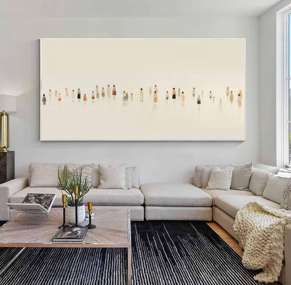 May include: Large abstract painting featuring a cream-colored background with a horizontal line of small, silhouetted figures in various colors. The artwork is displayed above a modern living room sofa and coffee table.