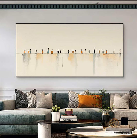 May include: A rectangular wall art piece featuring a horizontal line with a series of small, stylized bottle shapes in shades of orange, black, blue, and white. Below the line, soft, vertical watercolor-style washes in beige and gray extend downward.