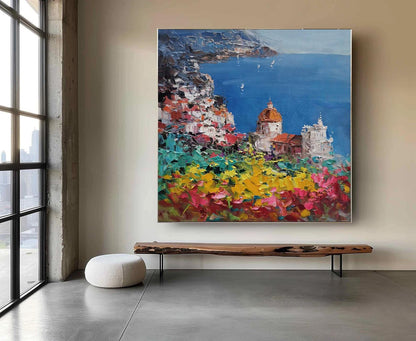 May include: A colorful abstract painting depicting a coastal town with buildings and a blue ocean. The painting features a vibrant palette of colors, including yellow, green, pink, and blue. The town is situated on a hillside overlooking the ocean, and the buildings are painted in a variety of colors. The painting is a beautiful and evocative depiction of a coastal town.