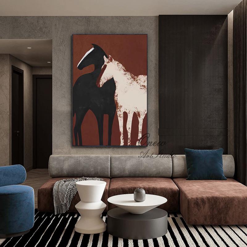May include: Abstract painting of two horses, one black and one white, against a red background. The painting is framed and hanging on a wall in a living room.