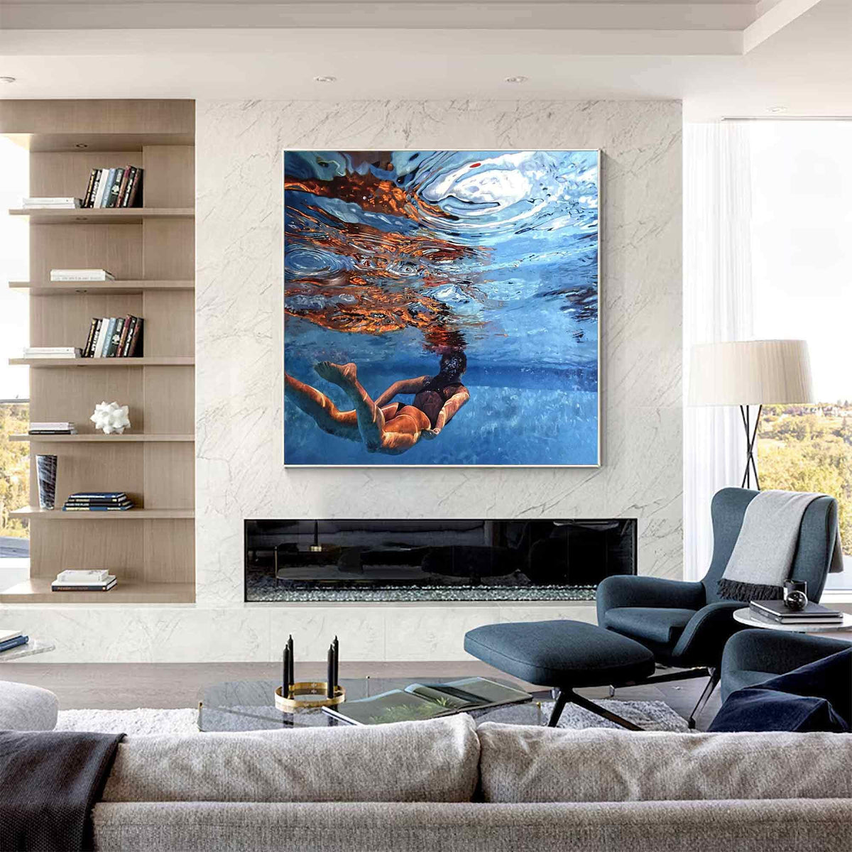 May include: A square wall art print featuring an underwater scene of a person swimming in a pool. The image captures the refraction of light on the water surface, deep blue tones, and the silhouette of the swimmer in a dark swimsuit.