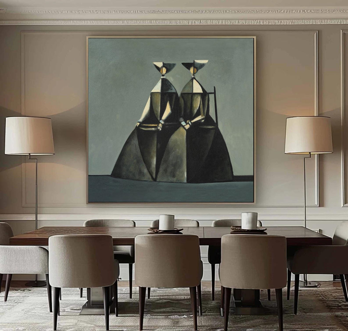May include: An abstract painting featuring two figures in geometric forms, primarily in shades of gray, black, and gold, set against a muted teal background. The artwork is framed and hangs above a dark wood dining table with neutral-toned chairs, complemented by floor lamps.