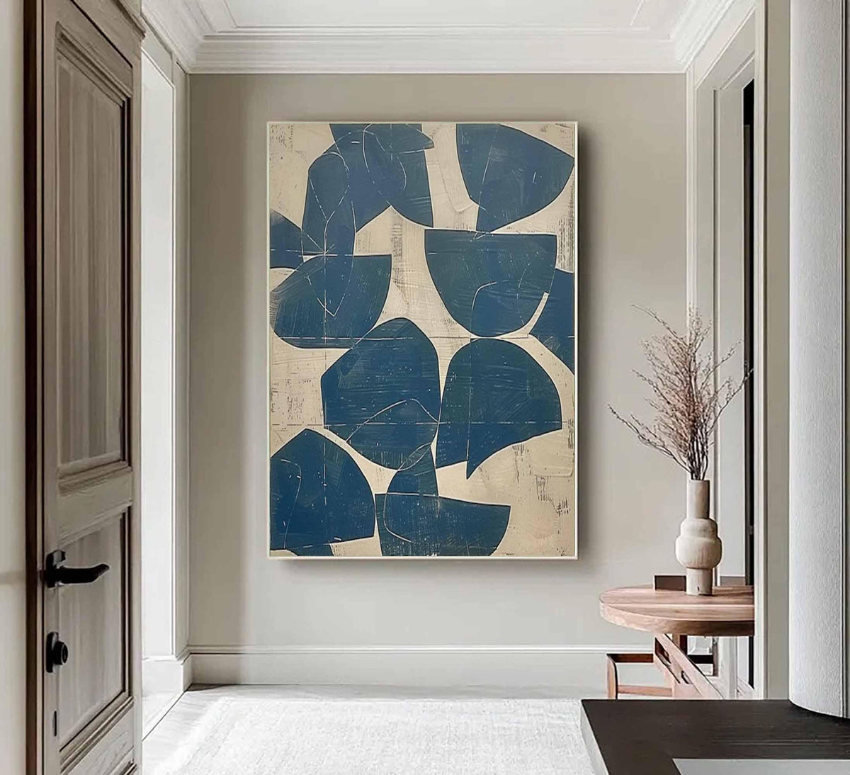 May include: A large rectangular wall art piece featuring a series of dark blue, semi-circular and irregular geometric shapes layered over a textured, light beige background. The composition displays a repeating pattern of bold, deep blue forms.