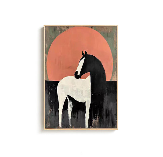May include: Abstract art print of a horse. The horse is depicted in black and white, set against a backdrop of a large, orange-red circle, possibly representing the sun. The artwork is framed in a light-colored wooden frame.