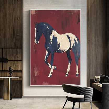 May include: A large framed canvas art print featuring a horse. The horse is depicted in a stylized manner with a navy blue and cream color palette. The background is a deep red with brushstroke textures, creating a dramatic effect.