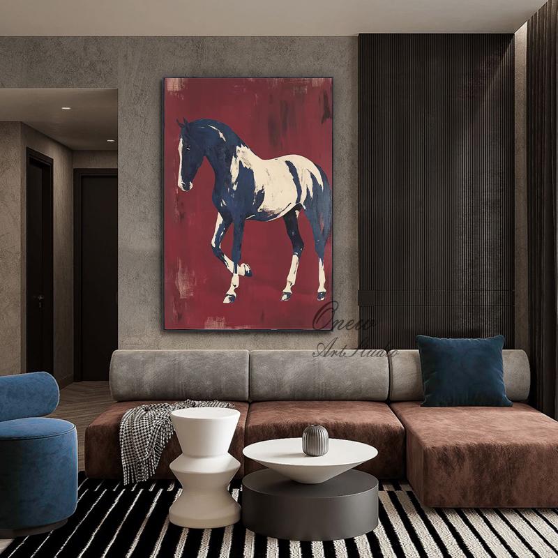 May include: A large canvas art piece featuring a horse in shades of navy blue and white against a deep red background. The artwork is displayed in a modern living room setting, above a brown and gray sectional sofa.