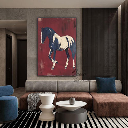 May include: A large canvas art piece featuring a horse in shades of navy blue and white against a deep red background. The artwork is displayed in a modern living room setting, above a brown and gray sectional sofa.