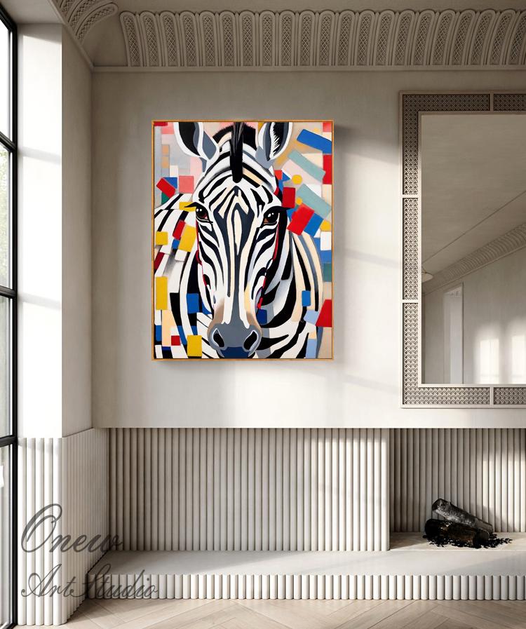 May include: A framed canvas art print of a zebra's head with a colorful geometric background. The zebra has black and white stripes, with a gray nose and brown eyes. The background features red, blue, yellow, and white shapes.