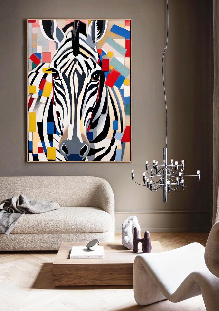 May include: A framed canvas art print featuring a close-up of a zebra's face with black and white stripes. The artwork incorporates colorful geometric shapes in red, blue, yellow, and gray, creating a modern aesthetic.