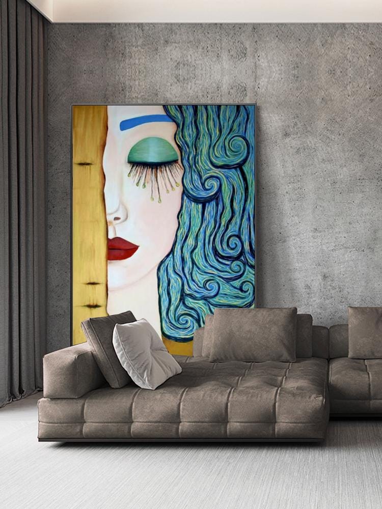 May include: A large, framed painting of a woman's face with closed eyes and red lips. The woman has blue hair and a teal eye shadow. The painting is displayed above a brown sectional sofa with several pillows.