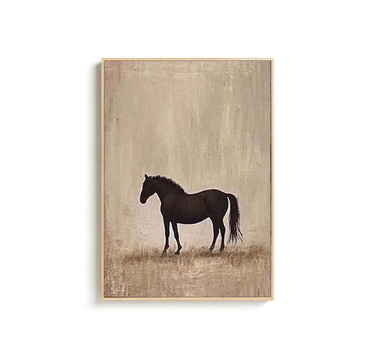 May include: A framed art print featuring a silhouette of a black horse against a muted beige background. The horse stands in a field of grass, with a simple, minimalist design. The artwork is enclosed in a light brown frame.
