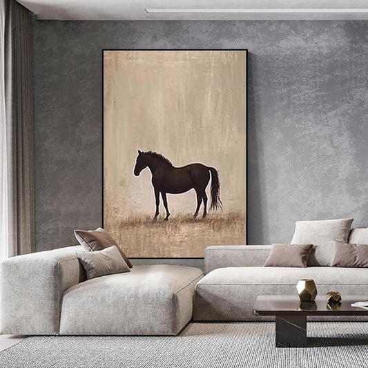 May include: A framed canvas art print featuring a dark brown horse silhouette against a beige and brown background. The artwork is displayed in a modern living room setting, with a gray sofa and coffee table.