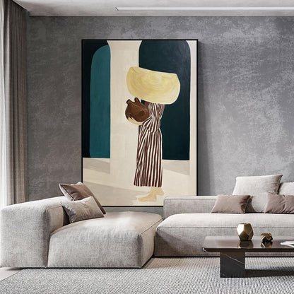 May include: Abstract painting featuring a figure carrying vessels, set against a backdrop of teal and white arches. The figure is dressed in a striped garment. The artwork is framed and displayed in a modern living room setting.