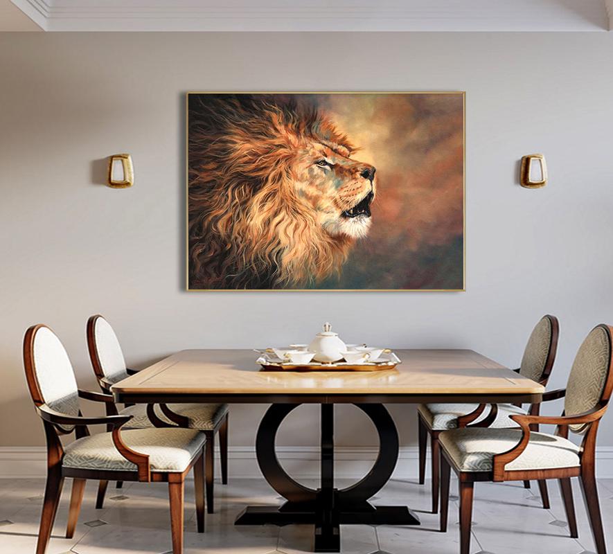 May include: A framed painting of a lion's head with a golden mane, set against a warm, blurred background. The artwork is displayed above a wooden dining table with chairs, creating a sophisticated interior design.