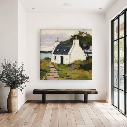May include: A square oil painting depicting a white cottage with a dark roof situated on a grassy landscape. A stone path leads toward the house, with a body of water in the background under a pale sky. The artwork features visible brushstrokes.