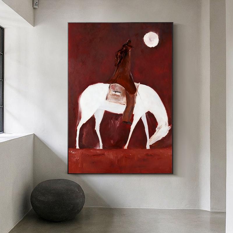 May include: Abstract painting of a white horse with a rider against a deep red background. A white moon is in the upper right corner. The artwork is framed in black and hangs on a neutral wall.