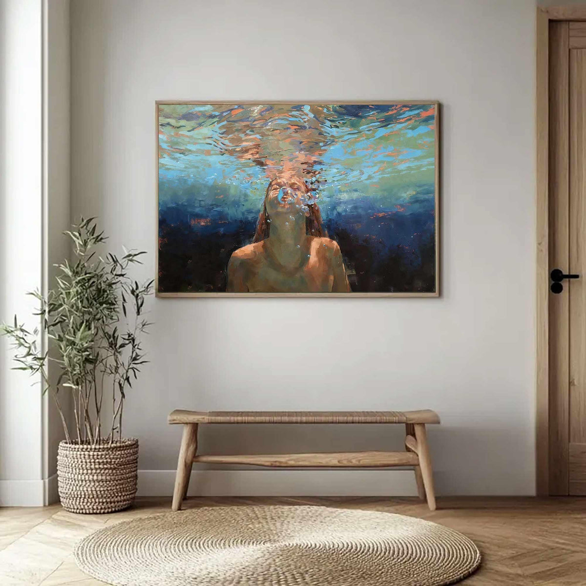 May include: A framed painting depicts a person underwater, with light filtering through the water. The artwork features shades of blue, orange, and brown, creating a serene and ethereal atmosphere. The painting is displayed above a wooden bench.