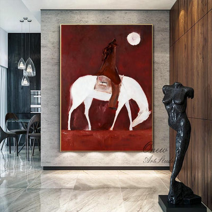 May include: Abstract painting of a rider on a white horse against a deep red background. The artwork features a full moon and is framed in gold. The style is minimalist and modern, suitable for home decor.