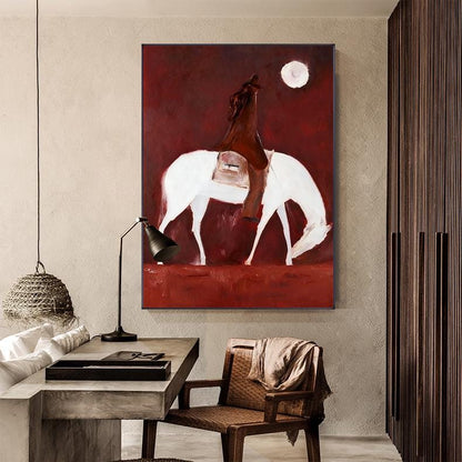 May include: Abstract painting of a rider on a white horse against a deep red background. The artwork features a full moon and a minimalist style, with the rider and horse as the central focus. The painting is mounted on a wall.