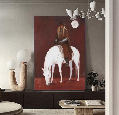 May include: A large canvas print depicts a person on a white horse. The person wears a brown cloak, hat, and armor. The background is a deep red, creating a dramatic contrast. The artwork is displayed in a modern living space.