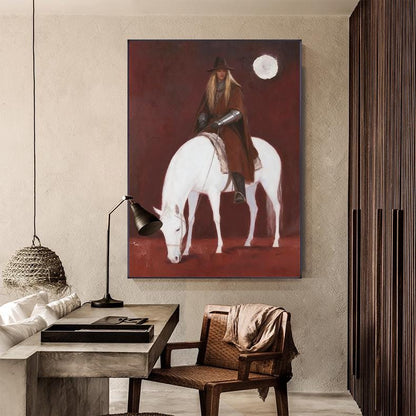 May include: A framed painting depicts a person on a white horse against a deep red background. The person wears a brown cloak, hat, and armor. A full moon is visible in the upper right corner. The horse is grazing, and the painting has a medieval theme.