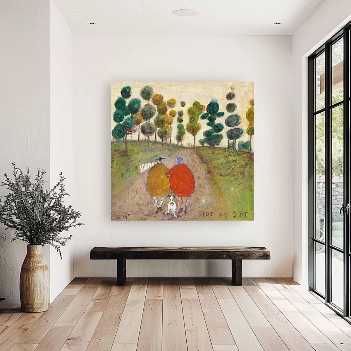 May include: A square wall art print titled SIDE BY SIDE featuring a painting of two figures in yellow and red coats walking with a small white dog on a dirt path through a green landscape with stylized trees under a pale yellow sky.