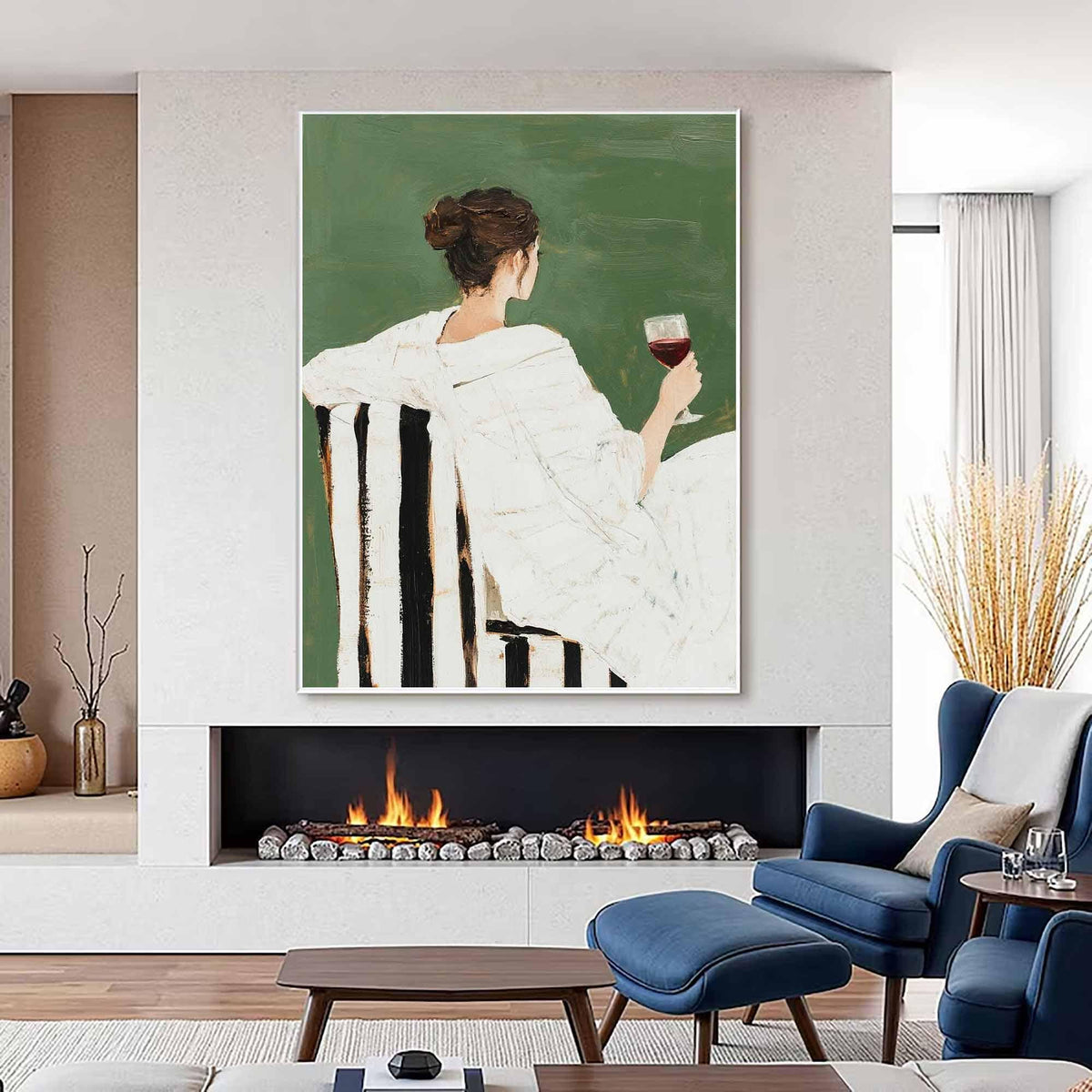May include: An oil painting depicts a person in a white robe seated in a black and white striped chair, holding a glass of red wine. The background is a solid green color. The artwork is displayed above a fireplace with a lit fire, and blue chairs are in the foreground.