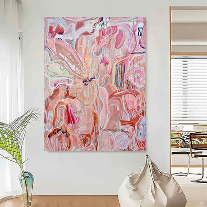 May include: Large abstract painting with a floral theme. The artwork features a blend of pink, peach, and white hues, with bold brushstrokes and organic shapes. The canvas is mounted on a white wall, creating a modern and artistic aesthetic.